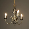 Zoey 3-light antique brass chandelier with traditional twist candle holders in candelabra style, elegant lighting fixture.