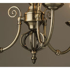 Zoey 3-light antique brass chandelier with traditional twist candle style and candelabra design, featuring elegant ornate details.
