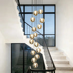 Light silver cluster pendant from Amice 15 collection by TheChandelierCo featuring amber-colored glass elements on a silver chain.
