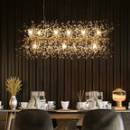 Gold Dandelion 9 light starburst pendant light from TheChandelierCo, ideal for kitchen island lighting, with a sunburst design.
